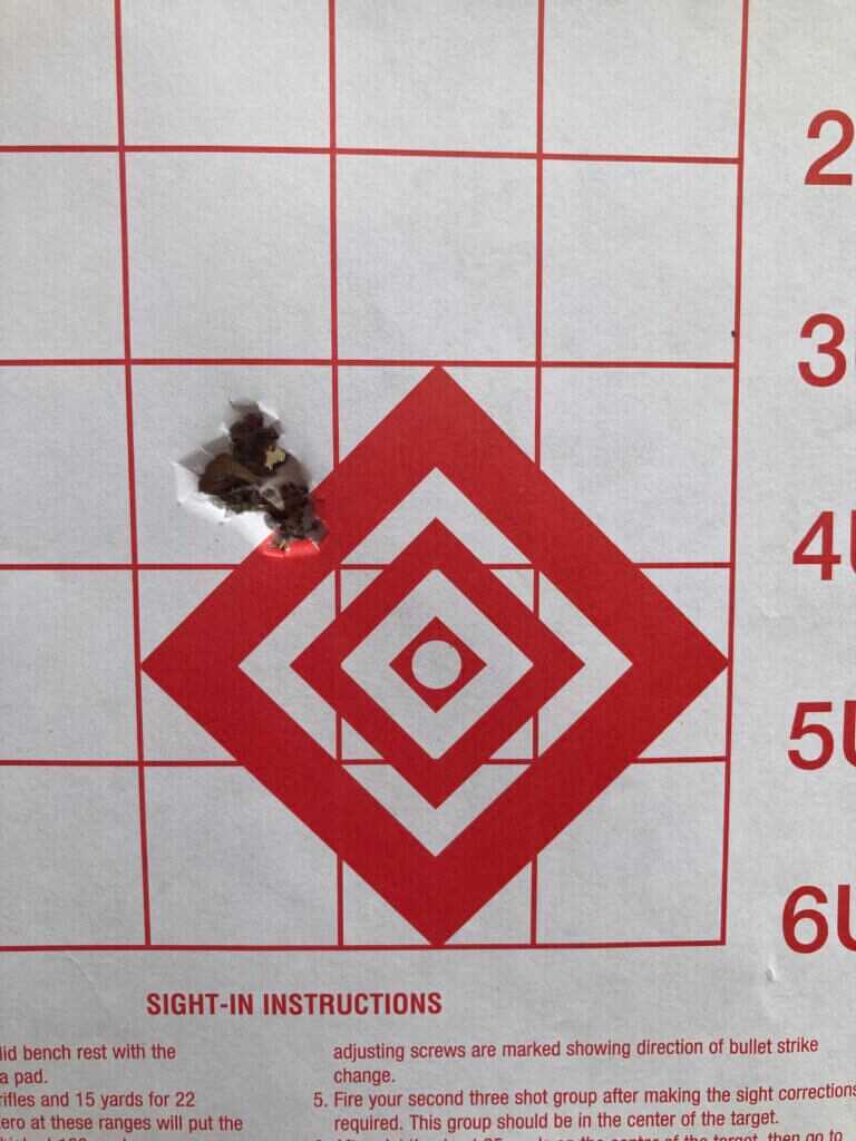 .361 inch group on a paper target with red lines and numbers