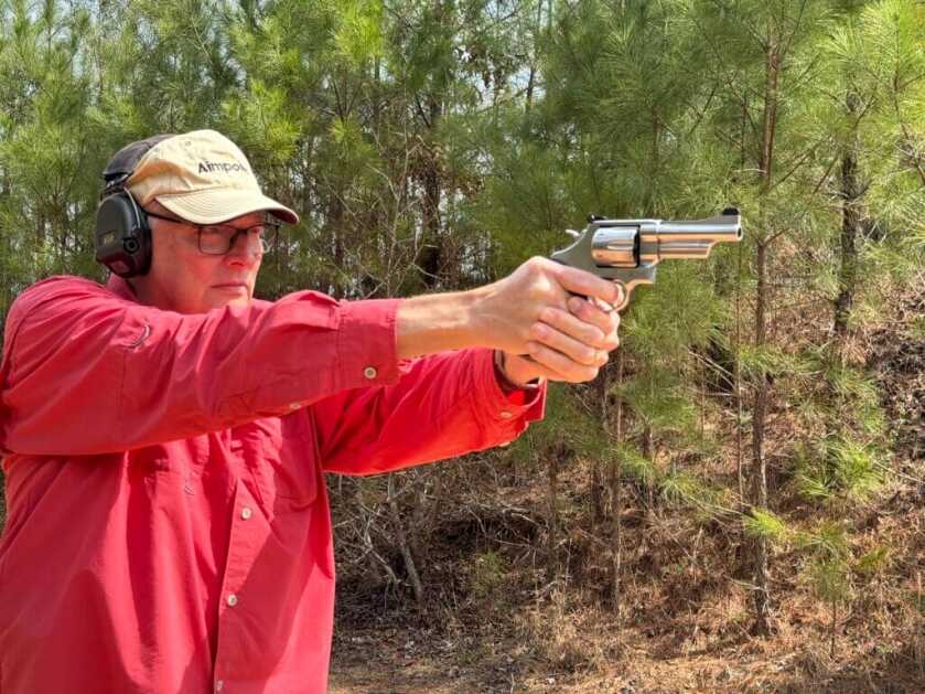 man shooting revolver. Mountain Gun