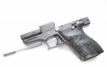 The steel barrel is pinned to the polymer frame and does not move when the gun fires.