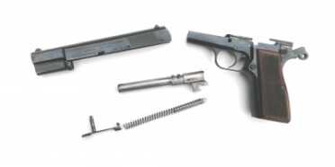 The High Power field strips easily. Simply lock the slide to the rear using the slide lock safety, press out the slide stop, and release the safety and the slide runs off of the frame. The barrel, recoil spring and spring guide are easily removed.