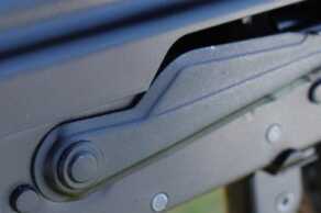 The dust cover may need to be bent up for the safety to fit under correctly.