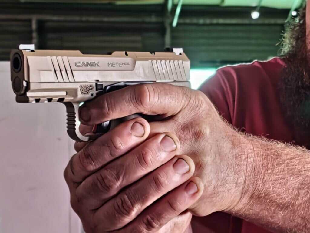man holding a pistol