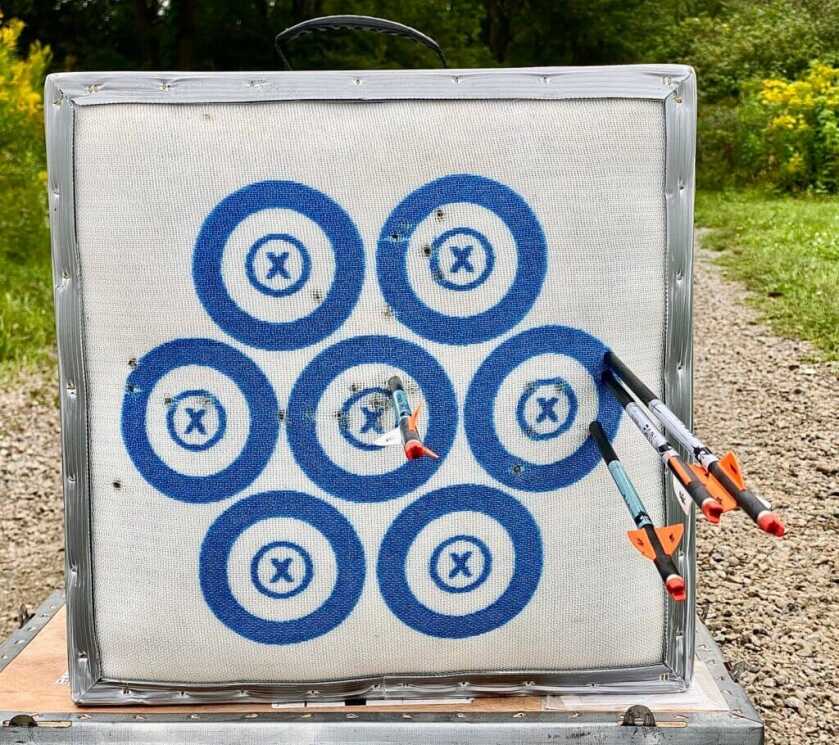 Ravin R470 50 yard group followed by scope adjustment and bullseye on shot number four