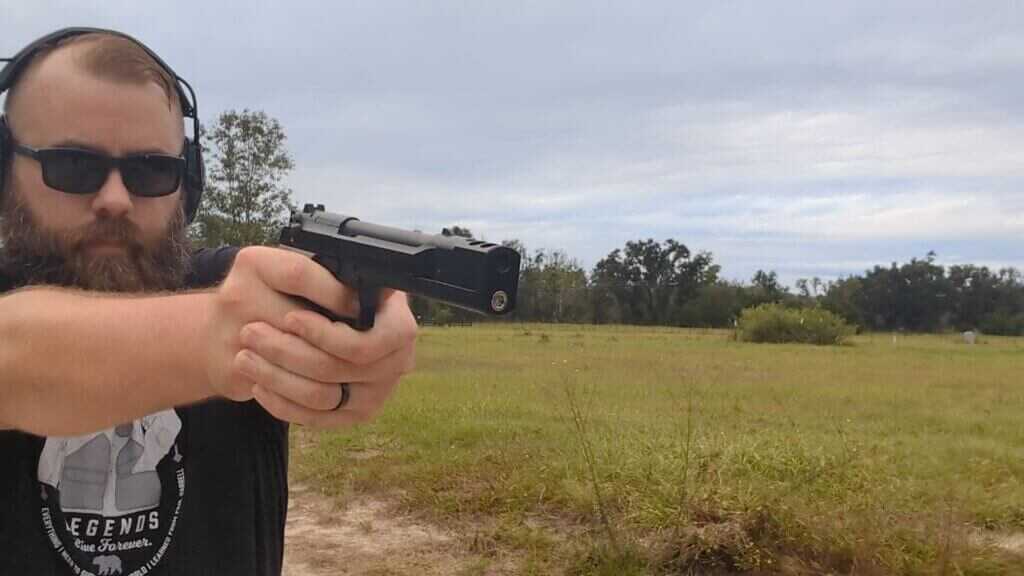 man shooting handgun