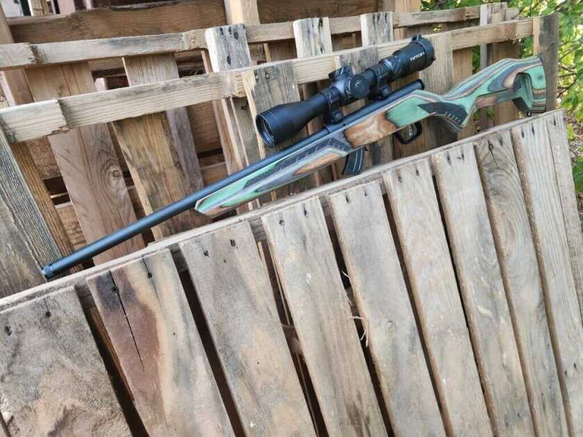 Savage Mark II Minimalist 21 Sharp on the bench with optic, threaded barrel and green stock