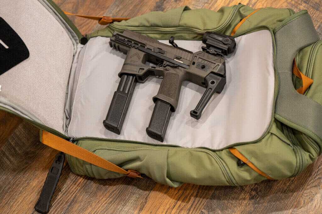 Vertx Gamut 32L CCW backpack open with SIG Sauer Flux Legion P320 staged for access