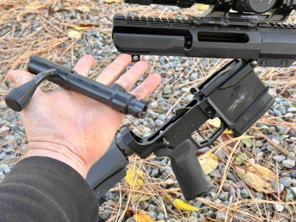 Closeup of the UP-10 three lug push feed bolt in hand.