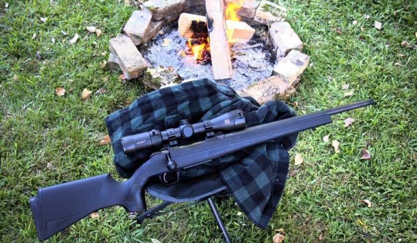 CZ 600+ Alpha rifle by a campfire in .243 Winchester
