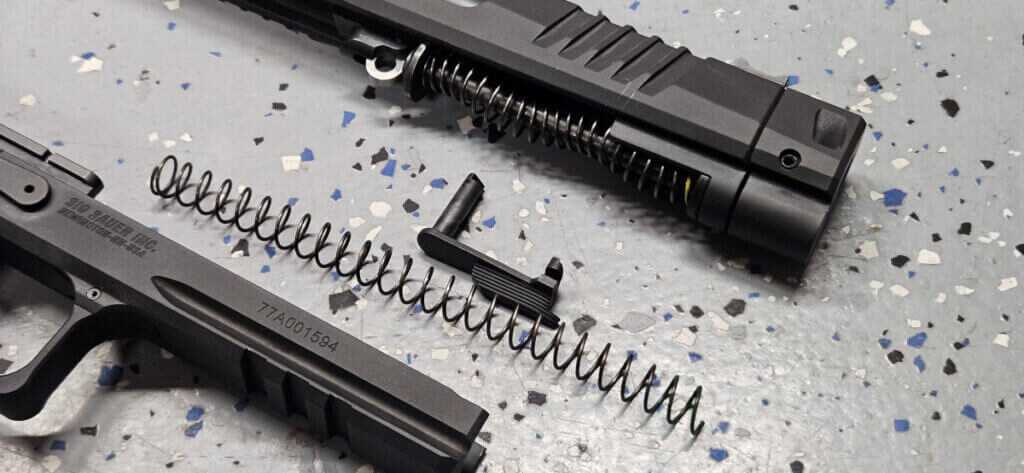 Two color coded recoil springs included with Sig P211 GTO for tuning 9mm loads