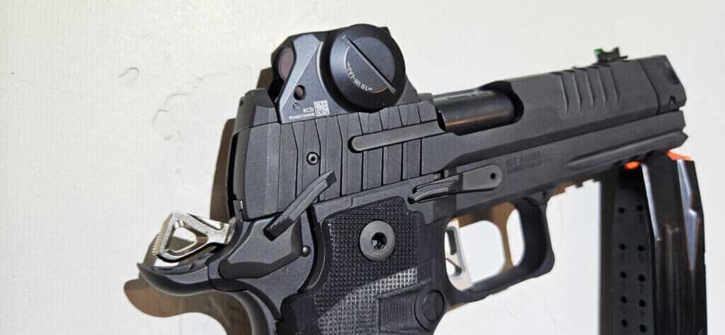 Close view of Sig P211 GTO controls with low mounted ROMEOX optic co-witnessing iron sights