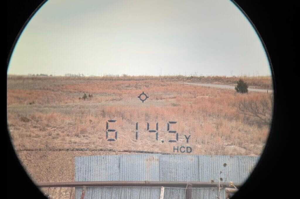 Vortex Triumph HD 850 ranging a grass hill at 614.5 yards during field testing