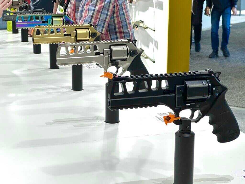 Four different colorways of the Rhino 44 mag are displayed in a row on the SHOT Show display counter.