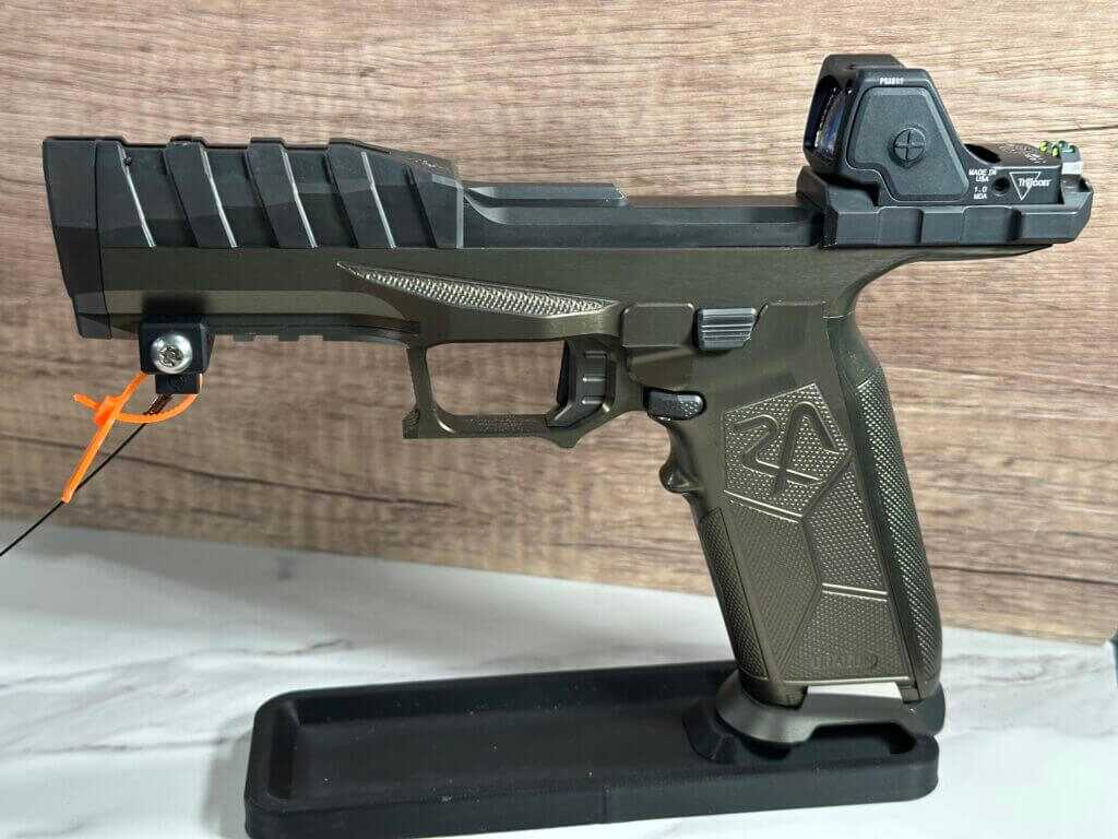 The Rideout Arsenal Dragon is positioned on a stand, pointing to the left. 