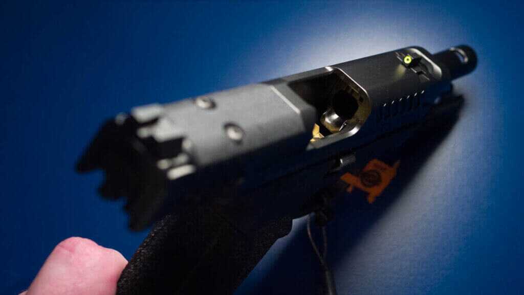 Close up view of the top of the slide with the slide retracted showing the polished feed ramp.