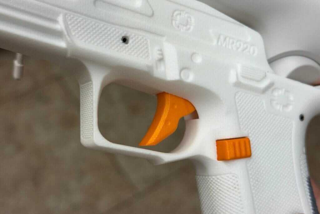 Close view of ACE VR handset trigger showing short reset and crisp break feel