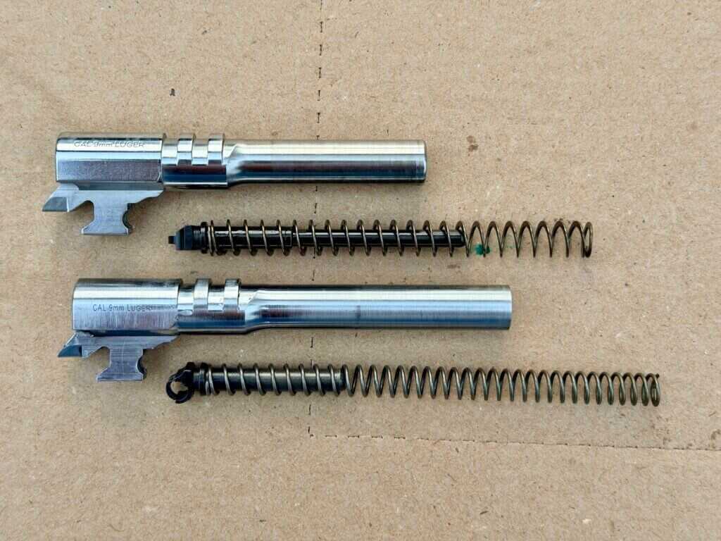Springfield Armory SA-35 4-inch barrel and recoil system beside the standard setup, showing the flat wire mainspring and longer guide