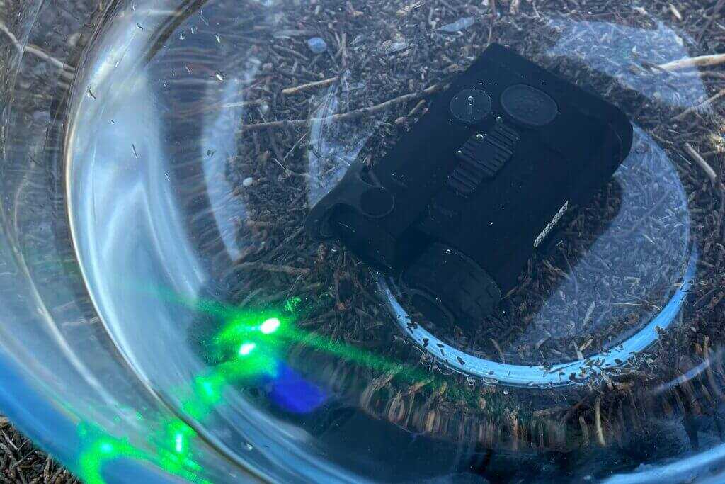Holosun IRIS-3 submerged in water during waterproof test