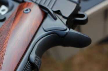 The safety lever is enlarged, and the grip safety has a bit of checkering for extra grip.