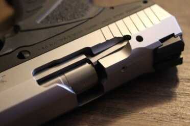 It isn't that much farther back, but the breech doesn't line up with the magazine, as it does on almost every other pistol.