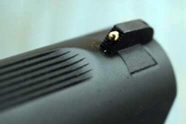 The slide has been milled so that flat serrations point toward the target. 