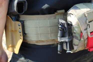 The SIG P226, in many of its incarnation, is a natural on a battle belt.