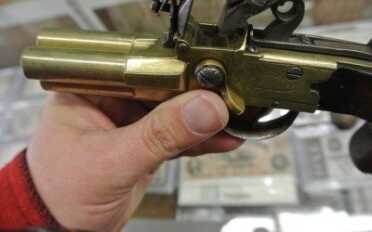 The lever by my thumb turns to let expose the touch hole for the different barrels.  They don't all three go off at once... in theory at least.