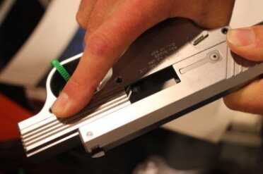 The slide in the open position shows the fixed barrel.