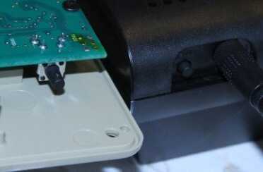 A button on both the transmitter and receiver register the two together. You have to do this before you close up the case after putting in the batteries. 