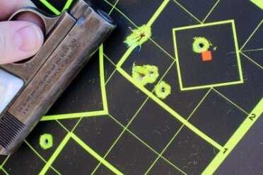 From 15 feet.  I have a hard time not dipping the barrel on the 1908. I think it is from squeezing the grip safety.