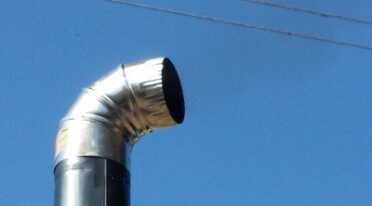 You can see some light smoke from this elbow. I put this at the top instead of the vent cap that comes with the stove. 