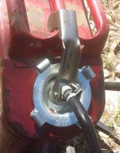 The red can fits the adapter perfectly. That arm is meant to lock onto the middle carry handle.