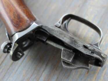 The trigger group is attached to the stock. 