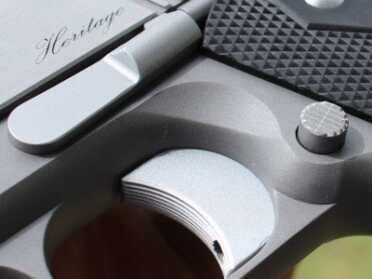 I really like the contracting colors of the stainless on this pistol. The black grips also look nice. 