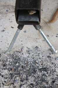 Getting a fire going and keeping it going in a stove this size isn't easy, but it really conserves fuel. This ash buildup is from me blowing in to get new fuel burning . Just beware that below the baffle becomes a "blow torch" so if you have a beard...