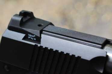 The rear sight has a ledge for one handed manipulation.