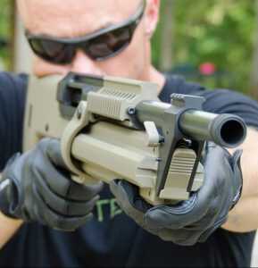 Rails on three sides above the magazine and barrel serve as heat shroud as well as a mounting point for accessories. 