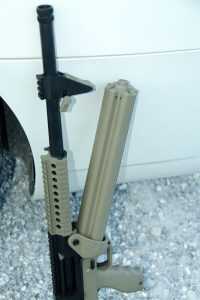 Once released, the rotary magazine is pulled down and away from the front to release it from the firearm for reloading.