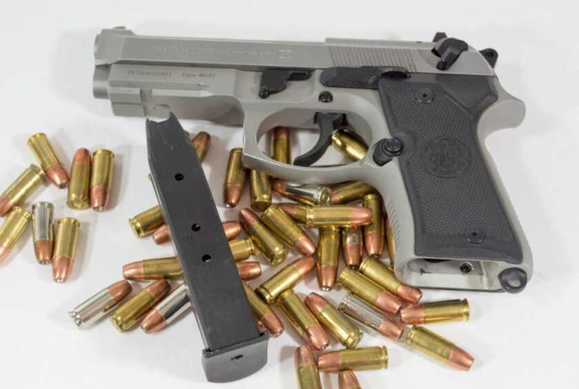The standard magazine holds 13 rounds so total capacity is 14 if you keep one in the chamber. 