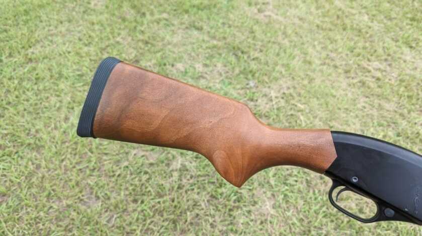 Winchester 1300 Defender series buttstock outside in front of green grass