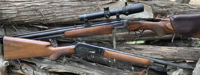 old school rifles with iron sights and scope