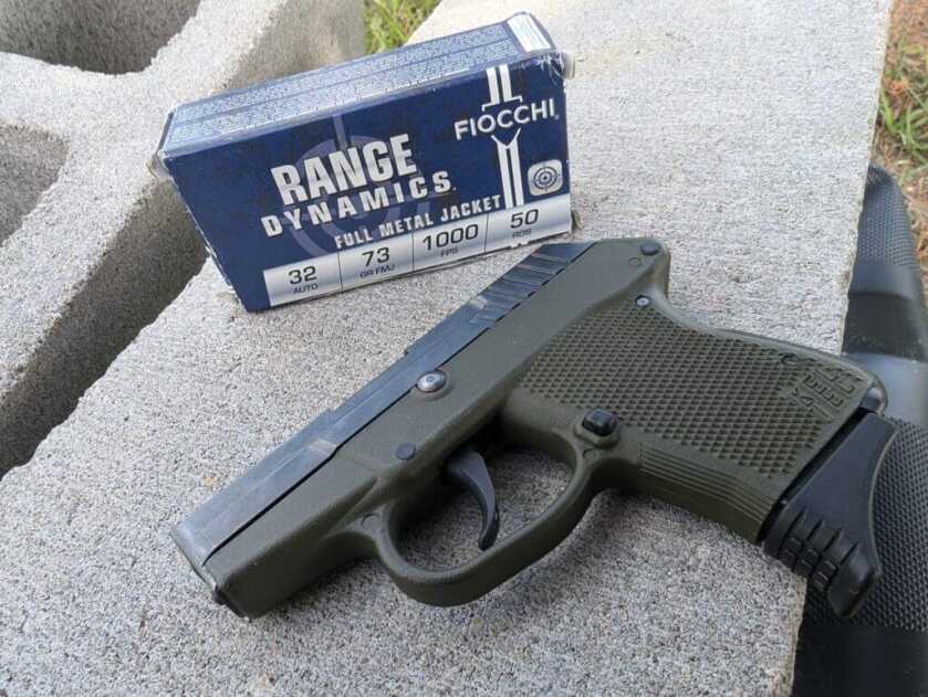 small pocket pistol on cement
