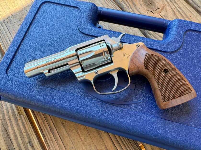 The Colt Viper revolver resting on a blue carry case