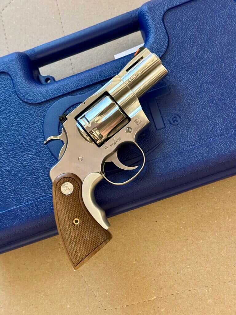Colt Python revolver right side with case