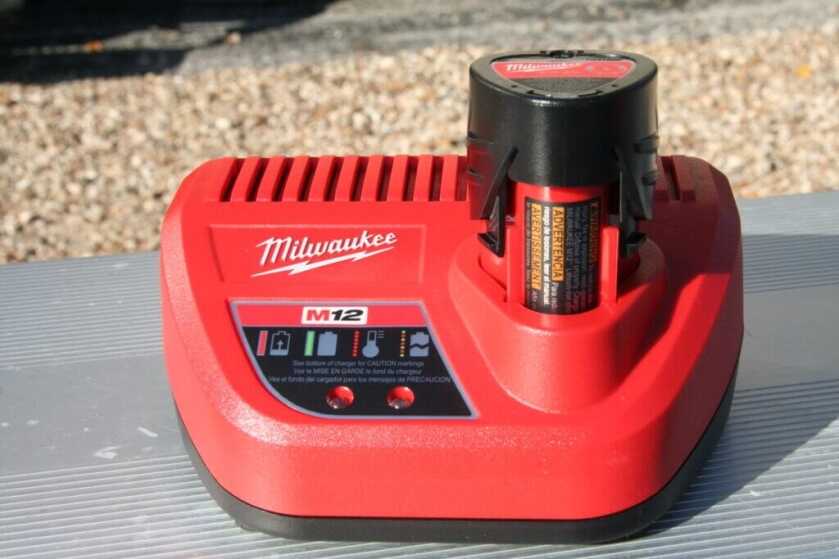 Milwaukee M12 rapid charger topping off 12V lithium ion battery for heated vest