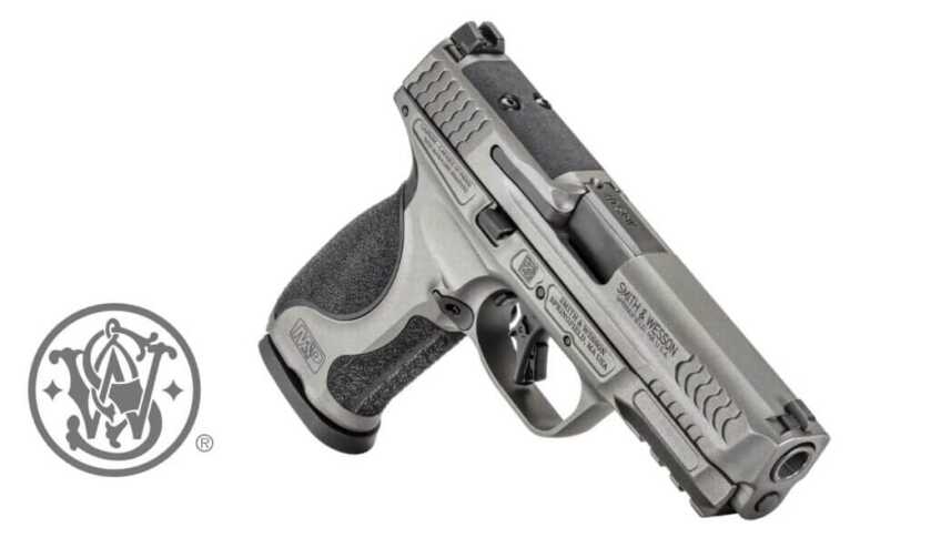 A black handgun is highlighted on a white background. 