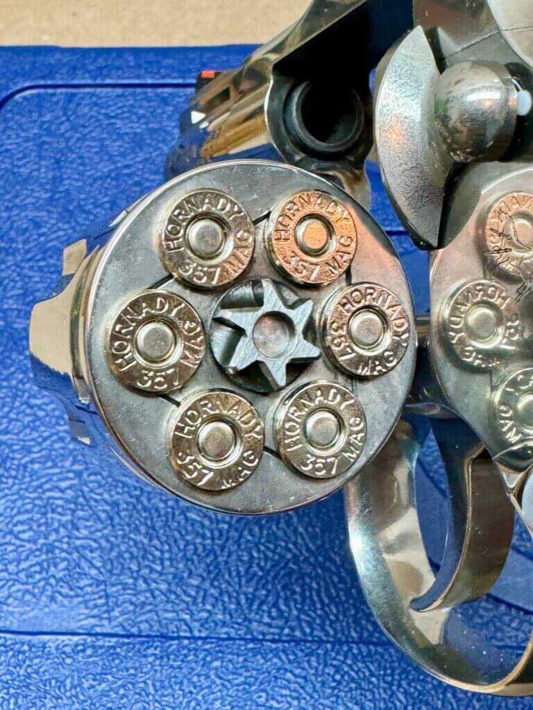 Colt Python revolver open cylinder showing ratchets 