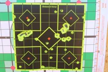 The small holes in this target are the .22 LR bullets from 50 yards. Several shots at each of the 5 centers. Then 2 different .410 loads from 25 yards.