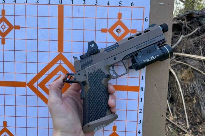 Review: 1911 That Takes Glock Mags?! Meet the Stealth Arms Platypus Stealth Arms Platypus and Vortex Defender-CCW without optic cover plate in front of practice target