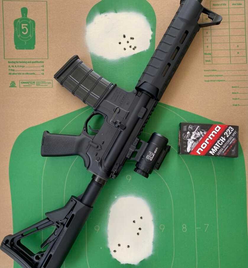 3 - Big Features, Small Scope: The P8 4x Prismatic Optic Ar-15 with optic sitting on green target with Norma ammo
