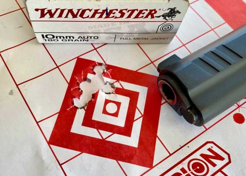 Girsan and EAA Witness 2311 Hunter 10 next to target and Winchester ammo